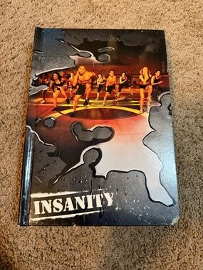 Insanity 10 piece CD workout series in box.